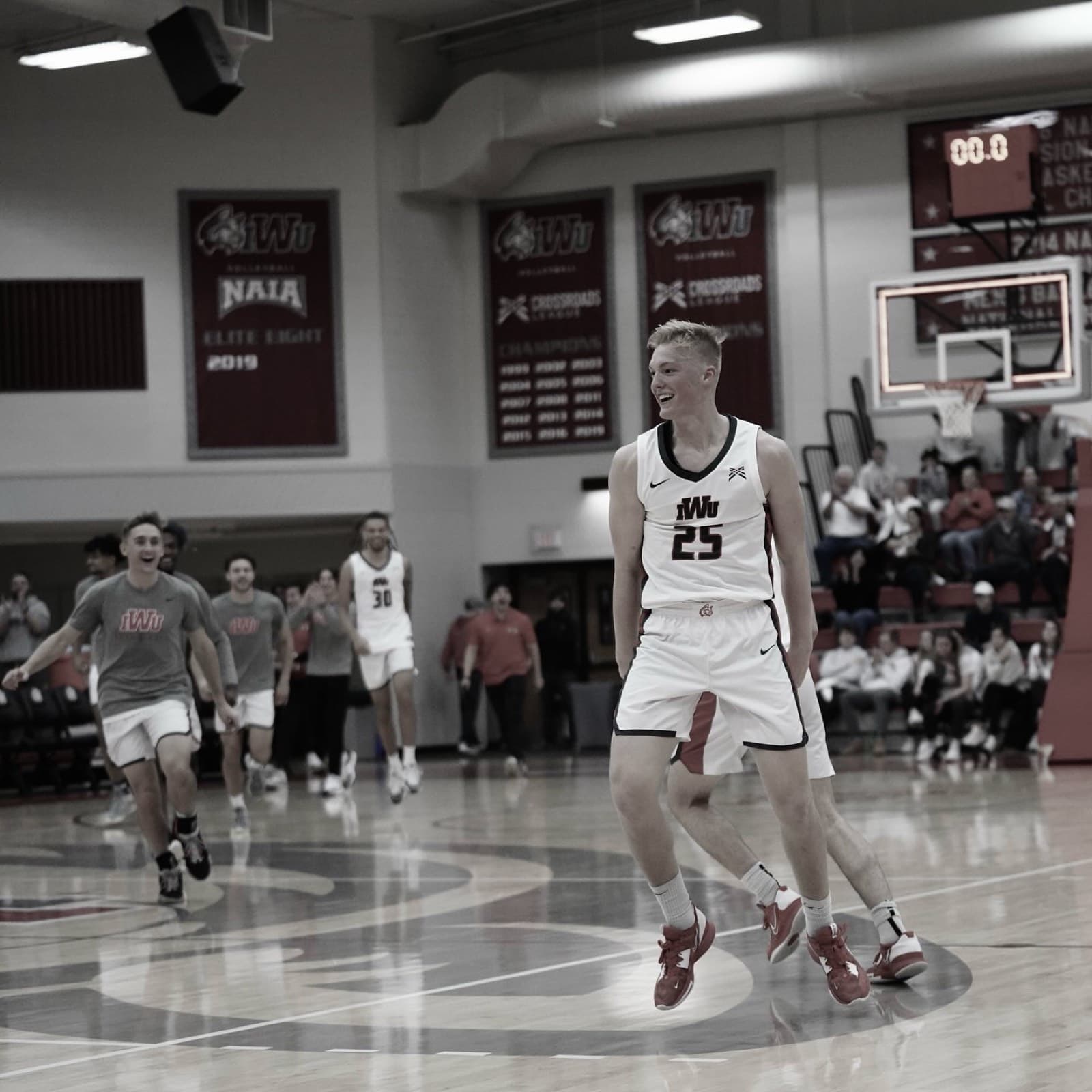 Nolan Mader celebrating with teammates after an Indiana Wesleyan win